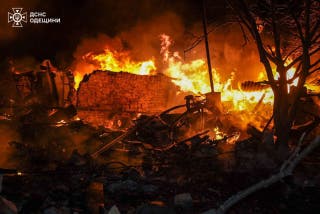 This handout photograph, which was taken and released by the Ukrainian State Emergency Service on March 28, 2025, shows a destroyed building on fire after a strike in OdesA region